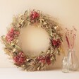 Pink Hydrangea Dried Flower Wreath on Neutral Background With Glass Vases