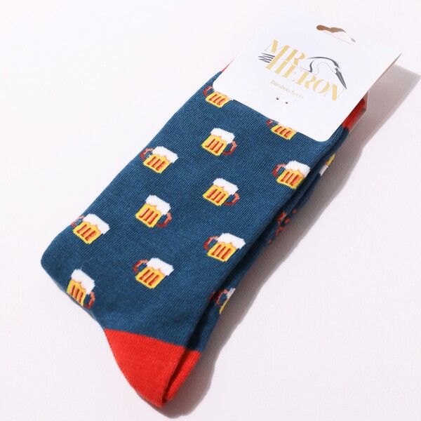 Mr Heron Men's Bamboo Beer Socks laid out on top of white backdrop