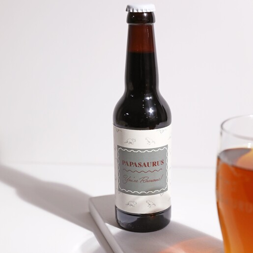 Papasaurus Malt Coast Beer on White Surface with Beer in Foreground