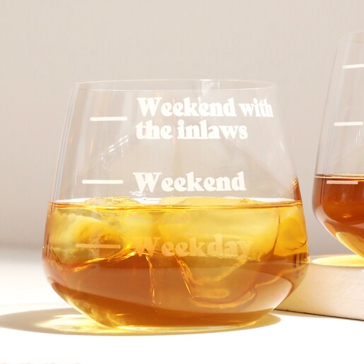 Personalised Measure Whisky Glass Personalised Measure Whisky Glass with whisky inside in front of white background