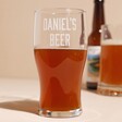 Personalised Name Beer Pint Glass in Front of Beer Glass and Bottle