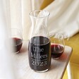 Personalised Name and Year Crystal Carafe with Miller personalisation with wine inside and stemless wine glasses behind