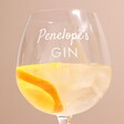 Close Up of Penelope personalisation on Personalised Script Name Balloon Gin Glass with drink inside