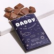 Best Daddy Salted Caramel Milk Chocolate Bar with Broken Chocolate Pieces on White Surface