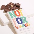 Not For Sharing Dark Chocolate Bar with Hazelnuts with Chocolate Pieces on White Surface