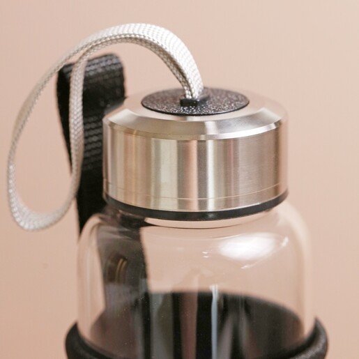 Close up of screw-on lid on Rose Quartz Purifying Glass Water Bottle