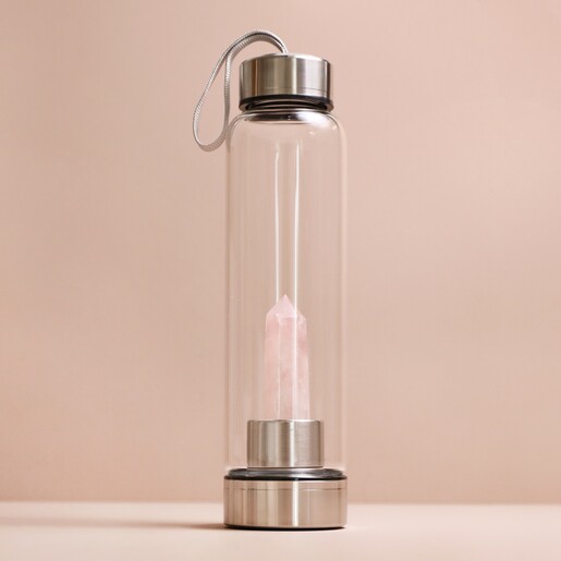 Rose Quartz Purifying Glass Water Bottle on neutral coloured background