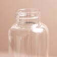 Close up of Rose Quartz Purifying Glass Water Bottle lid undone