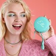Model Holding Personalised Mini Round Travel Jewellery Case in Turquoise