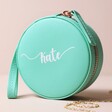 Turquoise Personalised Name Mini Round Travel Jewellery Case with Kate Personalisation on Beige Background