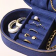 Personalised Sun and Moon Embroidered Oval Jewellery Case in Navy Open with Rings In Ring Rolls and Other Jewellery Pieces