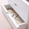 Gold Necklace in Bottom Drawer of White Jewellery Box with Drawers