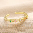 Adjustable Enamel Daisy Ring in Gold on Neutral Fabric