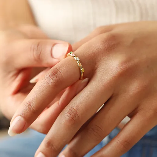 Model Wearing Adjustable Enamel Heart Ring in Gold