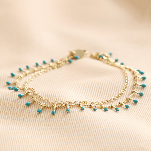 Blue Enamel Droplet Layered Anklet in Gold on Beige Fabric