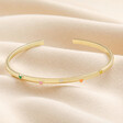 Adjustable Enamel Heart Bangle in Gold on Neutral Fabric