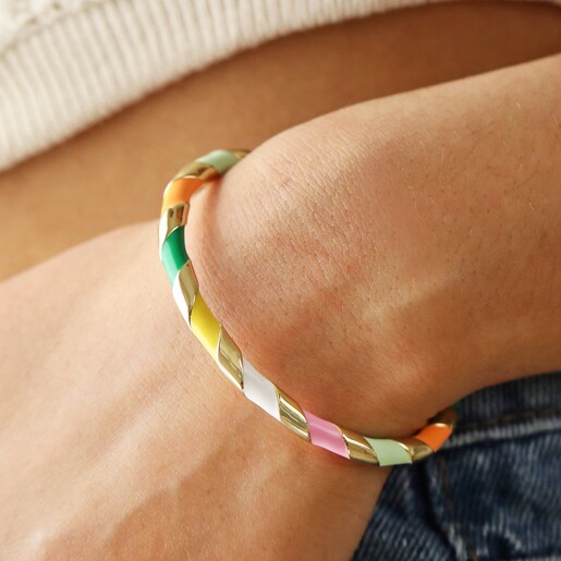 Close Up of Colourful Enamel Striped Bangle in Gold on Model