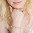Model wearing Colourful Miyuki Bead and Freshwater Pearl Bracelet with hand under chin