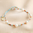 Colourful Miyuki Bead and Freshwater Pearl Bracelet on natural coloured fabric
