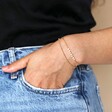 Freshwater Seed Pearl Double Chain Bracelet in Gold on model with hand in pocket