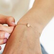 Gold Stainless Steel Semi-Precious Pink Aventurine Stone Bracelet on model holding chain