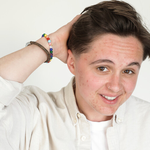 Pride Semi-Precious Beaded Bracelet in Rainbow on Model with Hand in Hair