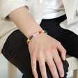 Pride Semi-Precious Beaded Bracelet in Rainbow on Model with Hand on Knee