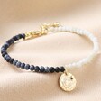 Talisman Moon Charm Navy and Grey Beaded Bracelet in Gold on Neutral Fabric
