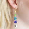 close up of Asymmetrical Millefiori Flower Bead Drop Earrings on model