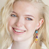 model smiling wearing Asymmetrical Millefiori Flower Bead Drop Earrings