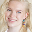 model smiling wearing Asymmetrical Millefiori Flower Bead Drop Earrings