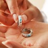 Model Holding Cloisonné Hoop Earrings in Silver in Palm of Hand