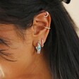 Close Up of Cloisonné Hoop Earrings in Silver on Model with Curated Ear