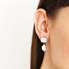 Close up of Crystal Stud and Freshwater Pearl Drop Earrings in Gold on brunette model