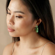Model with Dark Hair Wearing Dried Flower Resin Hoop Earrings in Green