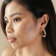 Brunette Model Wearing Dried Flower Resin Hoop Earrings in Pink