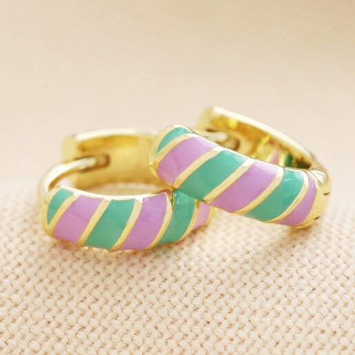 Enamel Striped Huggie Hoop Earrings in Purple and Green on beige coloured fabric