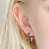 close up of Green Baguette Crystal Hoop Earrings in Gold on model