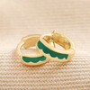 Green Enamel Scalloped Huggie Hoop Earrings in Gold on Beige Coloured Fabric