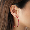 Large Tortoiseshell Resin Hoop Earrings in Red on Model