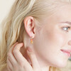 Model wearing Millefiori Heart and Flower Drop Earrings in Gold with hand behind ear