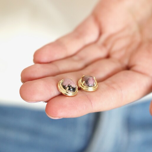 Model holding Pink Semi-Precious Stone Stud Earrings in Gold between fingers