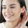 Model Wearing Pink Twisted Enamel Hoop Earrings in Gold with Hands Behind Ear