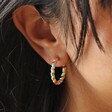Close Up of Model Wearing Rainbow Enamel Twist Hoop Earrings in Gold