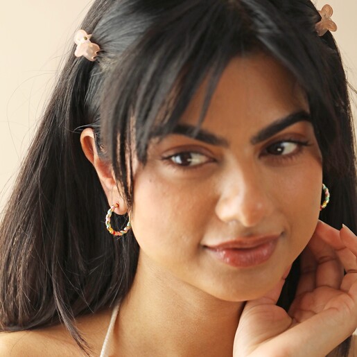 On Model Worn With Pink Y2K Hair Clips Model Wears Rainbow Enamel Twist Hoop Earrings in Gold With Pink Y2K Hairclips