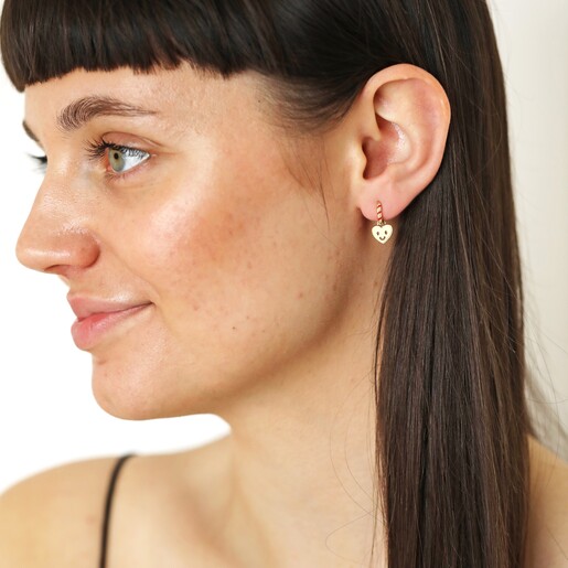 Red and Gold Heart Face Huggie Hoop Earrings on Dark haired model looking to side