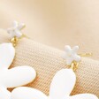 Close Up of Stud Fastening on White Enamel and Pearl Daisy Drop Earrings in Gold