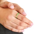 Adjustable Green Enamel Twist Ring in Gold on Models Hand with White Background