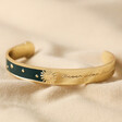 Navy Enamel Message Engraved Celestial Bangle in Gold on Neutral Fabric