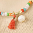 Close Up of Pearl and Tassel on Colourful Pearl and Tassel Beaded Necklace in Gold 